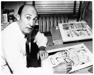 Will Eisner at drawing board